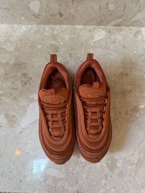 Nike woman’s 97’s air max sneaker color russet metallic